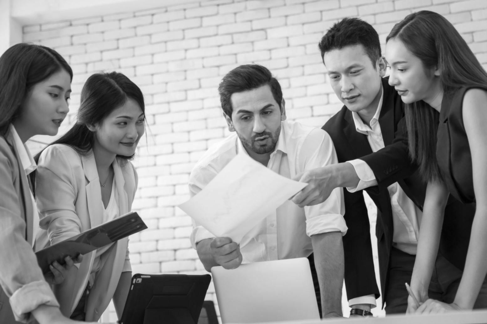Financial professionals analyzing market data and investment portfolios in modern trading environment